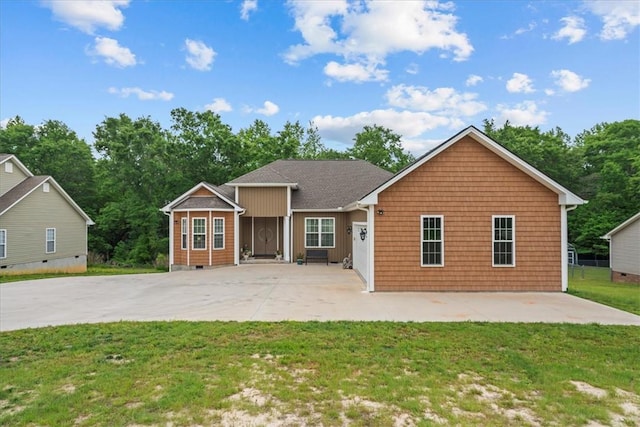 single story home with a patio area, a front yard, and concrete driveway