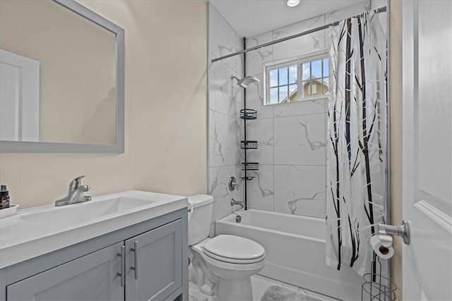 bathroom featuring vanity, toilet, and shower / tub combo