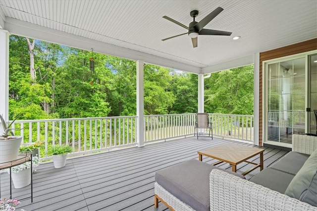 wooden terrace featuring ceiling fan