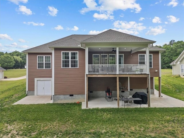 back of property featuring crawl space, a ceiling fan, a deck, a yard, and a patio