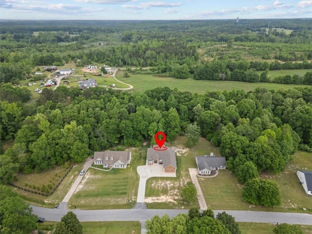 drone / aerial view with a view of trees