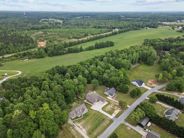 bird's eye view featuring a view of trees