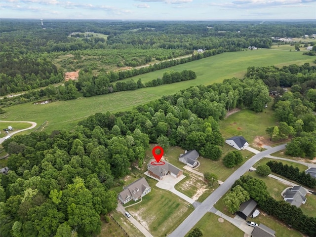 bird's eye view featuring a forest view