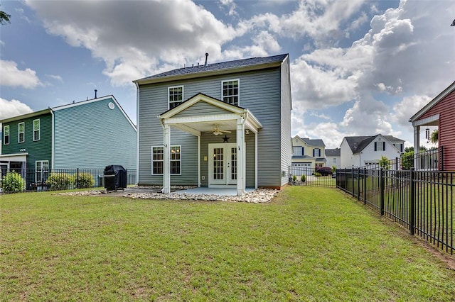 127 Ledgewood Way, Easley, SC 29642 - back of property with ceiling fan, a fenced backyard, a patio area, french doors, and a lawn