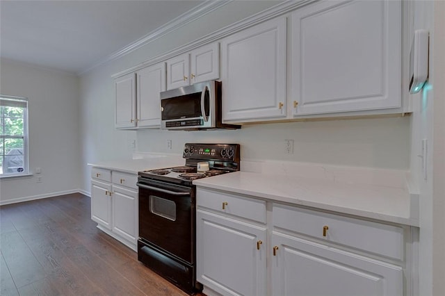 127 Ledgewood Way, Easley, SC 29642 - kitchen with crown molding, dark wood-style flooring, white cabinets, black electric range, and stainless steel microwave
