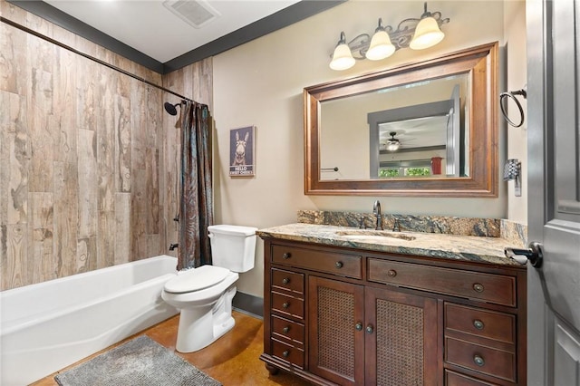 full bath with toilet, vanity, visible vents, and shower / bathtub combination with curtain