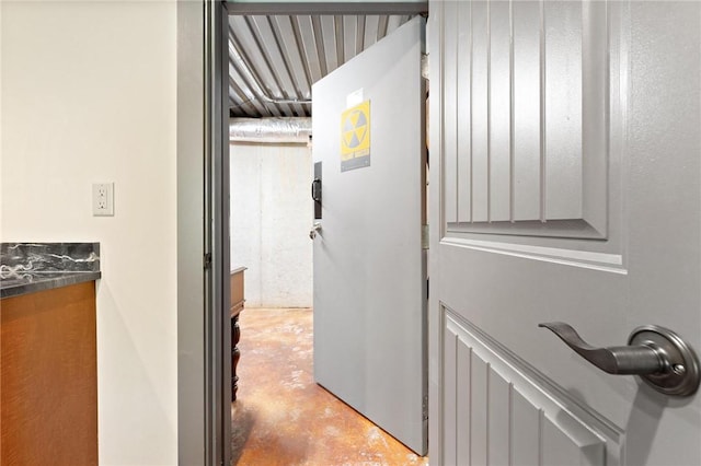 corridor featuring finished concrete floors
