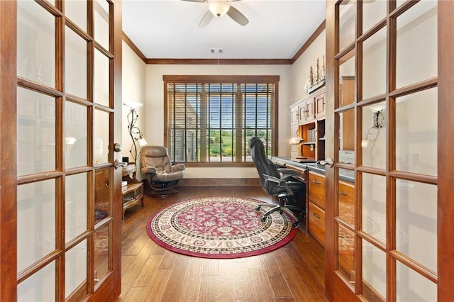 office space featuring french doors, a ceiling fan, ornamental molding, and hardwood / wood-style flooring