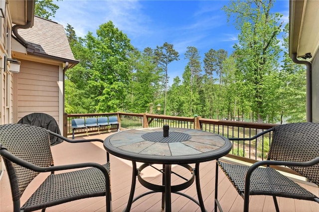 wooden deck featuring outdoor dining space