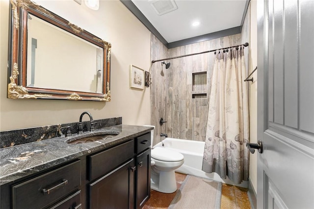 bathroom with vanity, toilet, tile patterned floors, and shower / bath combo