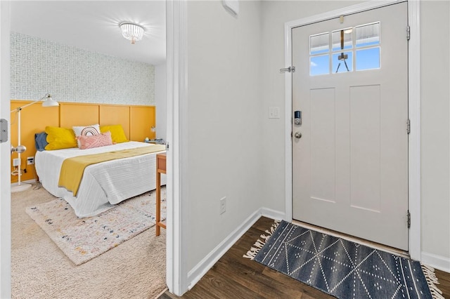 entryway featuring wood finished floors and baseboards