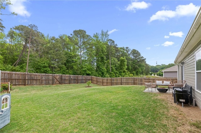 view of yard with an outdoor living space, a patio, and a fenced backyard