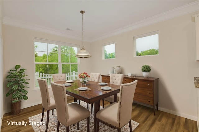 dining area featuring wood finished floors, ornamental molding, and baseboards