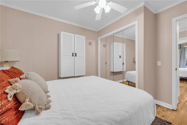 217 Hughes St, Seneca, SC 29672 - bedroom with a closet, light wood-type flooring, crown molding, ceiling fan, and baseboards