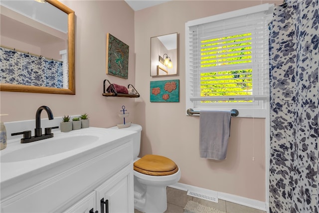 217 Hughes St, Seneca, SC 29672 - full bath featuring toilet, a shower with curtain, vanity, visible vents, and tile patterned flooring