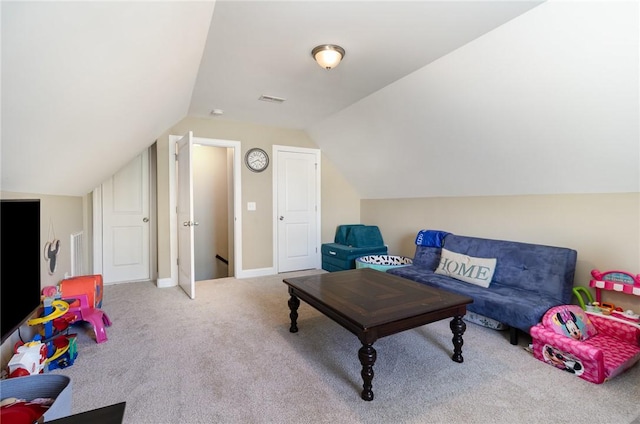 interior space featuring lofted ceiling and visible vents
