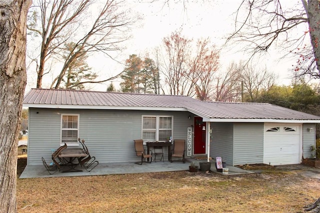 203 Adams St, Westminster, SC 29693 - view of front of house featuring a front lawn, a garage, and metal roof