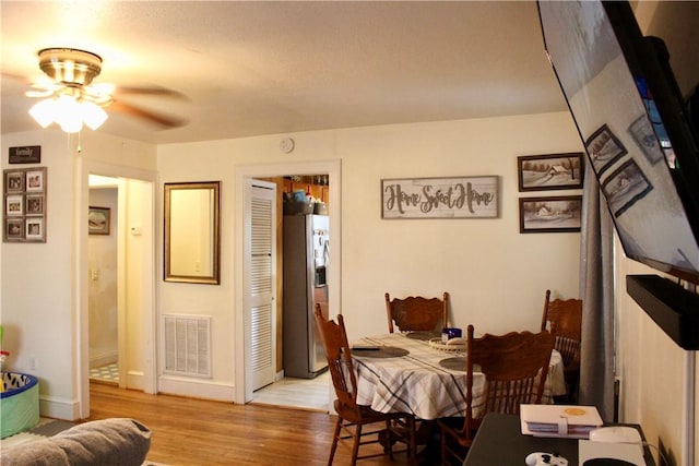 203 Adams St, Westminster, SC 29693 - dining room with a ceiling fan, baseboards, visible vents, and wood finished floors