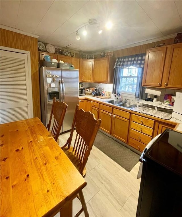 203 Adams St, Westminster, SC 29693 - kitchen with a sink, brown cabinets, tile counters, stove, and stainless steel fridge with ice dispenser