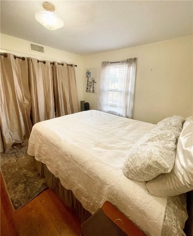 203 Adams St, Westminster, SC 29693 - bedroom featuring visible vents and wood finished floors