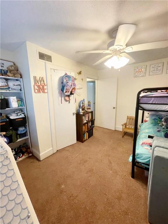 203 Adams St, Westminster, SC 29693 - bedroom with light colored carpet, ceiling fan, and visible vents