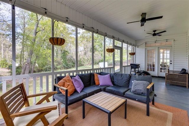 sunroom / solarium with ceiling fan, a wealth of natural light, french doors, and an outdoor living space