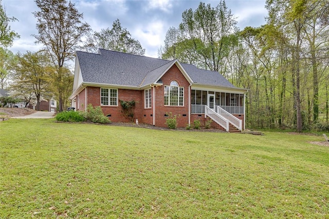 single story home featuring brick siding, a sunroom, a shingled roof, crawl space, and a front yard