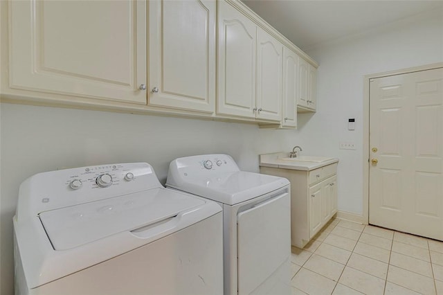 laundry room with separate washer and dryer, cabinet space, and light tile patterned floors