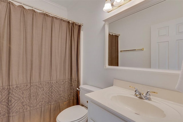 bathroom with crown molding, toilet, and vanity