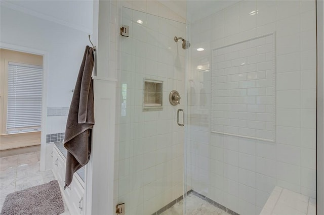 bathroom featuring a stall shower and crown molding