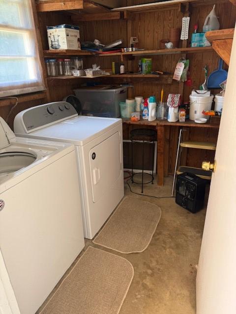 clothes washing area with washing machine and dryer and laundry area
