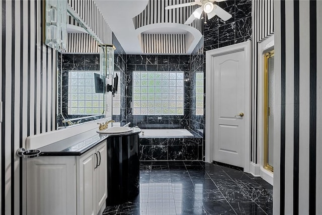 107 Amanda Dr, Anderson, SC 29621 - bathroom featuring a ceiling fan, marble finish floor, vanity, and a bath