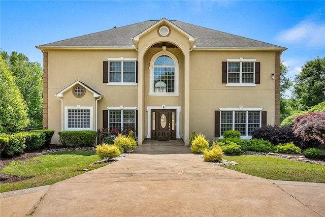 107 Amanda Dr, Anderson, SC 29621 - view of front of home with a shingled roof, stucco siding, and a front lawn