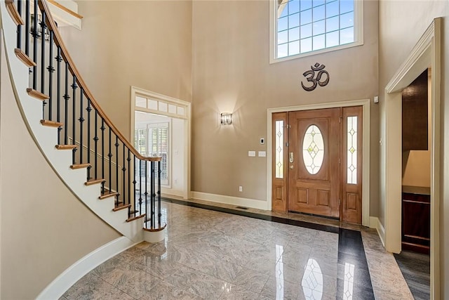 107 Amanda Dr, Anderson, SC 29621 - entrance foyer with baseboards, marble finish floor, a towering ceiling, and a wealth of natural light