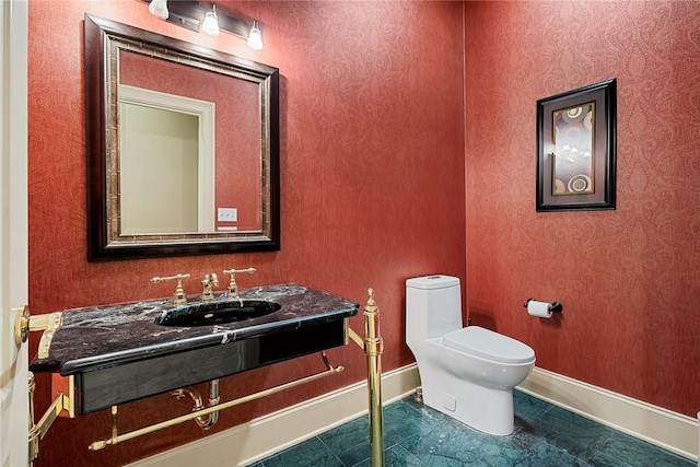 107 Amanda Dr, Anderson, SC 29621 - half bathroom with a sink, toilet, and baseboards