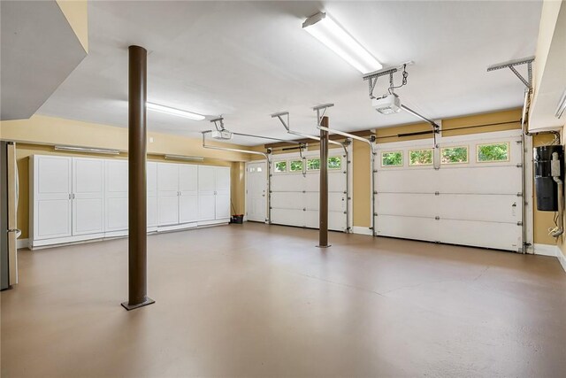107 Amanda Dr, Anderson, SC 29621 - garage featuring freestanding refrigerator and a garage door opener