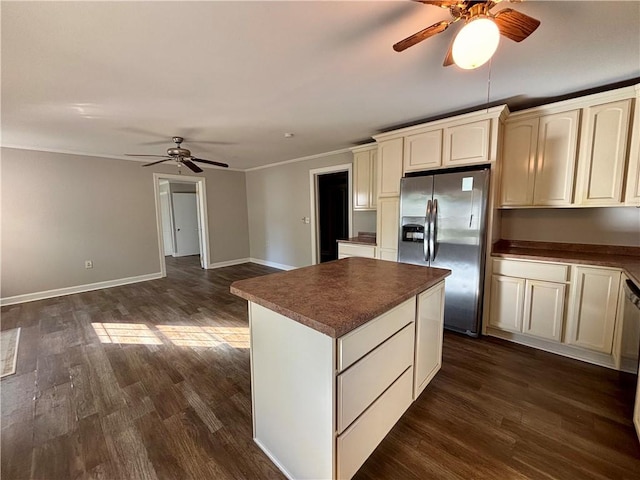 5192 Davis Cir, Anderson, SC 29625 - kitchen with stainless steel fridge, a ceiling fan, dark countertops, dark wood-style floors, and crown molding