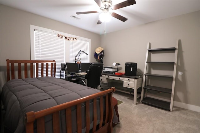 bedroom with baseboards, ceiling fan, visible vents, and light colored carpet