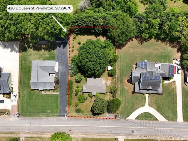 aerial view of property and surrounding area featuring property parcel outlined