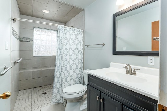 102 Norman St, Liberty, SC 29657 - bathroom with toilet, tiled shower, vanity, and tile patterned flooring