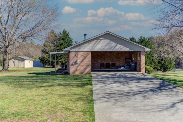 102 Norman St, Liberty, SC 29657 - view of home's exterior featuring a lawn, driveway, brick siding, an outdoor structure, and an attached carport