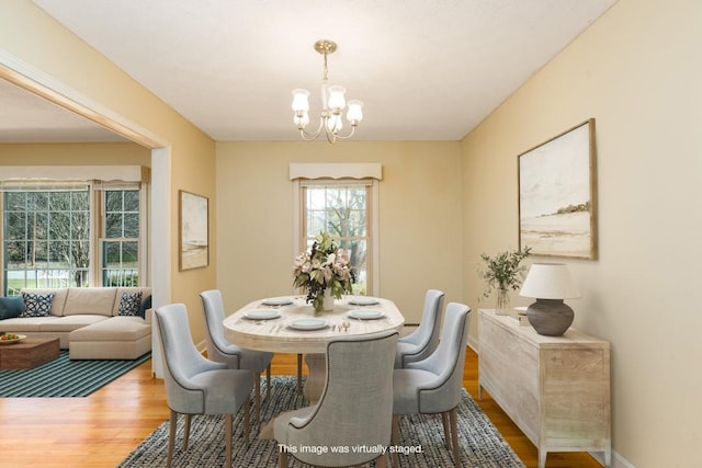 102 Norman St, Liberty, SC 29657 - dining area with an inviting chandelier, baseboards, and wood finished floors