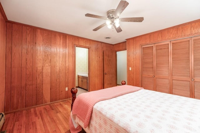 102 Norman St, Liberty, SC 29657 - bedroom featuring wood walls, a closet, ornamental molding, light wood finished floors, and ceiling fan