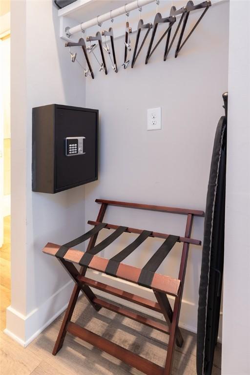 interior space with wood finished floors and baseboards