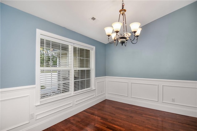 103 Mar Mac Rd, Anderson, SC 29626 - empty room with a decorative wall, a wainscoted wall, visible vents, dark wood finished floors, and an inviting chandelier