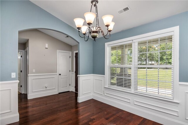 103 Mar Mac Rd, Anderson, SC 29626 - unfurnished dining area featuring arched walkways, dark wood-style flooring, a notable chandelier, and plenty of natural light