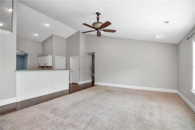 103 Mar Mac Rd, Anderson, SC 29626 - unfurnished living room featuring dark colored carpet, baseboards, ceiling fan, and high vaulted ceiling
