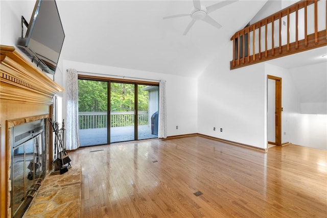 110 Safe Harbor Cir, Salem, SC 29676 - unfurnished living room featuring a glass covered fireplace, high vaulted ceiling, wood finished floors, and a ceiling fan
