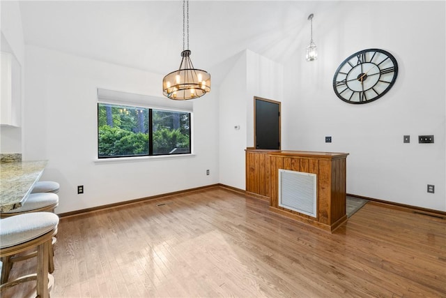 110 Safe Harbor Cir, Salem, SC 29676 - living room featuring wood finished floors, a chandelier, and baseboards