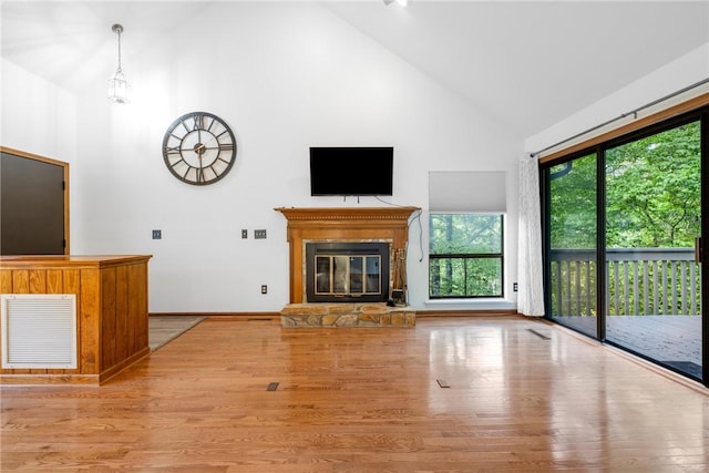 110 Safe Harbor Cir, Salem, SC 29676 - unfurnished living room featuring high vaulted ceiling, wood finished floors, a fireplace, and baseboards